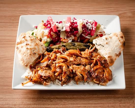 Döner over rice with salad and warm flatbread